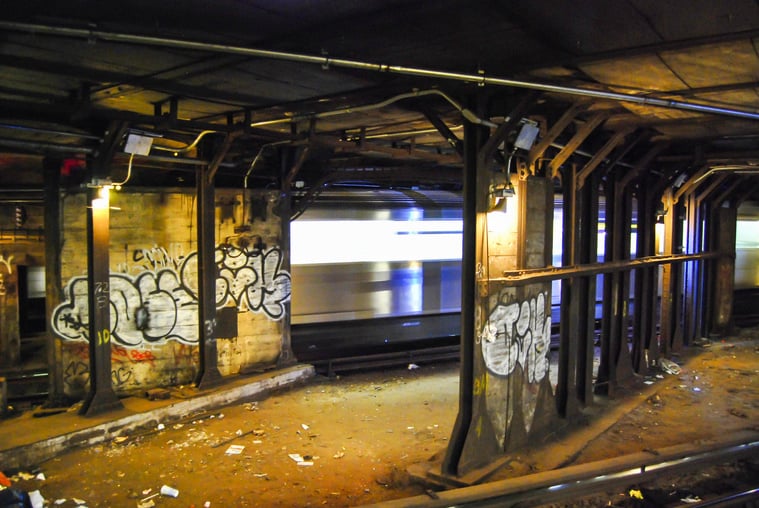 Subway Graffiti with Passing Train